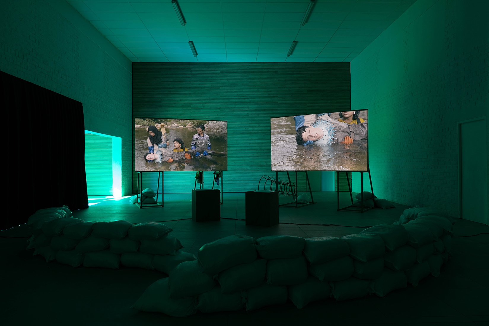 https://www.abrideswardt.com/files/gimgs/th-81_Installation view Abri de Swardt, Kammakamma (2022-2024), Synchronised two-channel projection, configurable screens, sand from Macassar Dunes, and costumes, 16’54 min 4.jpg